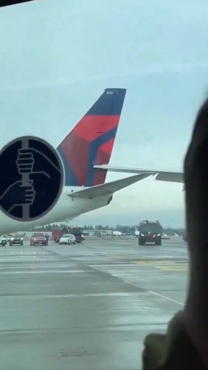 Wing wedged in tail of another plane after collision at US airport