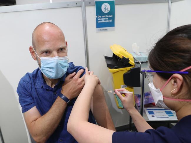 Victoria’s Covid-19 commander Jeroen Weimar gets his vaccine booster. He has called for changes in testing requirements for interstate travel. Picture: David Crosling