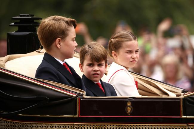 The king's grandchildren George, Charlotte and Louis watched the parade