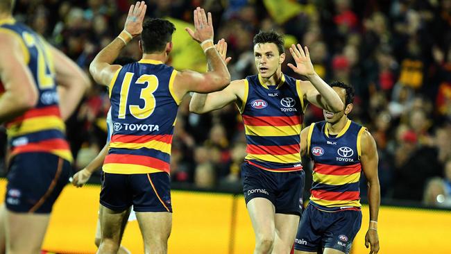 Here’s a sight we won’t see for a while, Taylor Walker and Jake Lever celebrating together. Picture: Tom Huntley