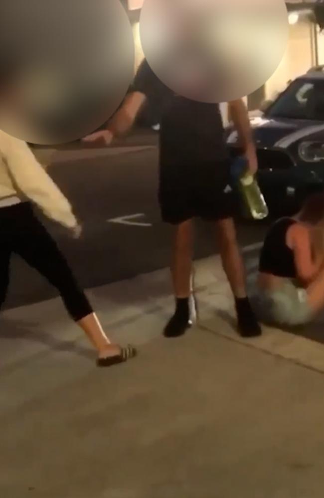 Images of a girl being attacked on a busy street in Wynnum's CBD.