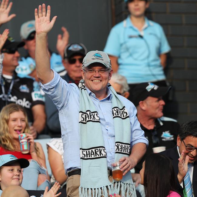 Prime Minister Scott Morrison waves to the crowd on arrival to the Cronulla Sharks v Manly Sea Eagles NRL match on Sunday. Picture: Brett Costello