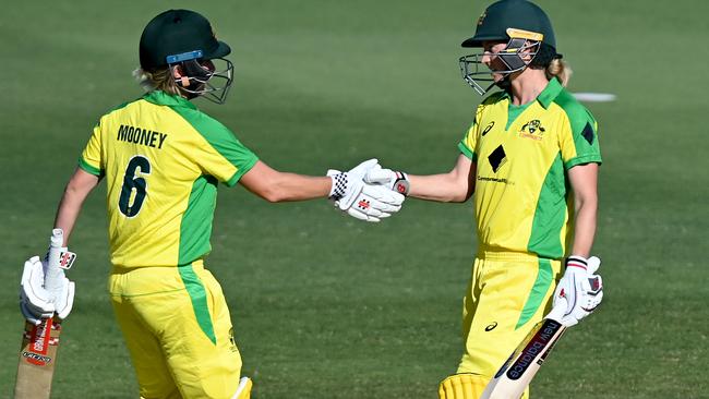 Beth Mooney congratulates Meg Lanning on reaching her half century. Picture: Getty Images