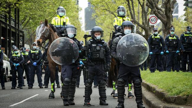 A heavy police presence is seen on Elizabeth Street outside the CFMEU office.