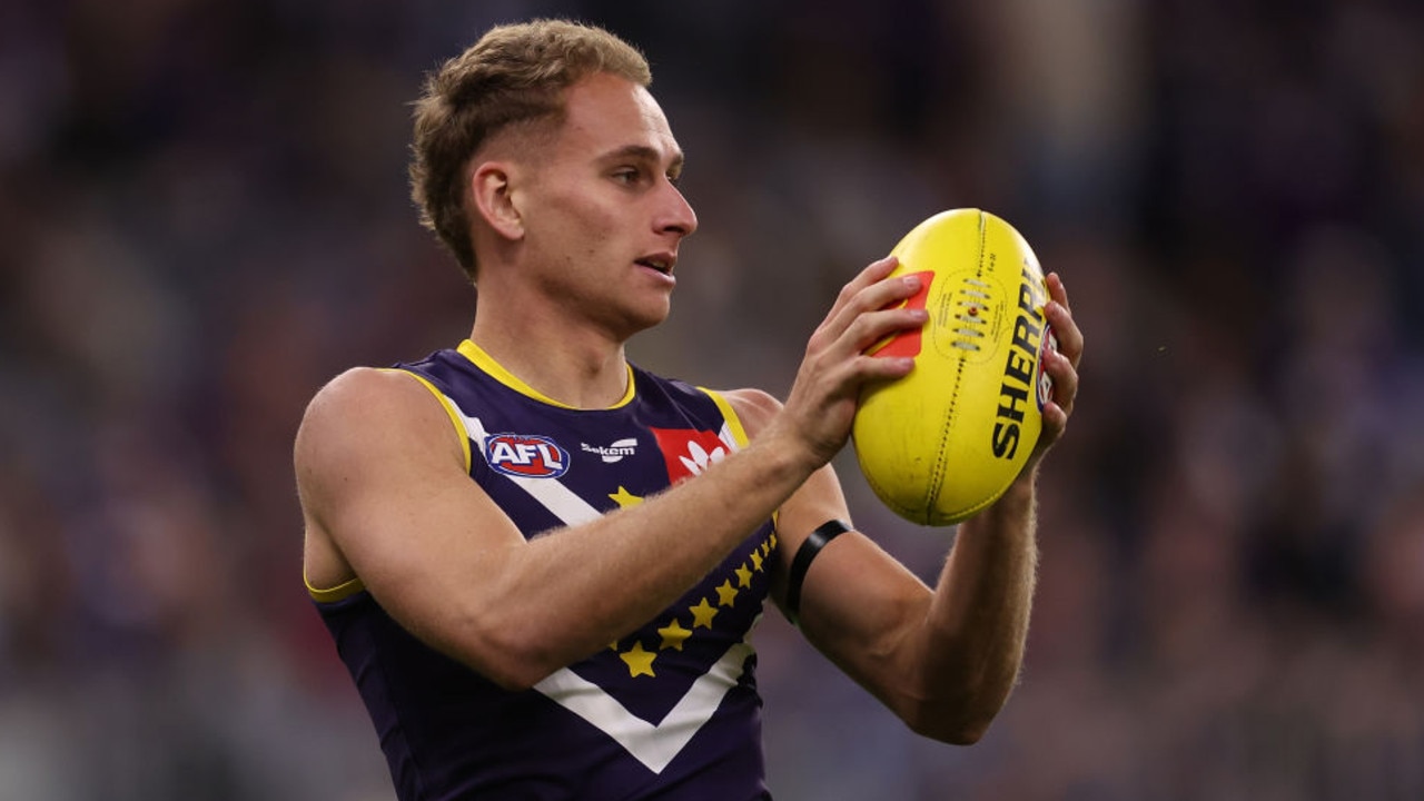 PERTH, AUSTRALIA - APRIL 09: Will Brodie of the Dockers marks the ball during the round four AFL match between the Fremantle Dockers and the Greater Western Sydney Giants at Optus Stadium on April 09, 2022 in Perth, Australia. (Photo by Paul Kane/Getty Images)