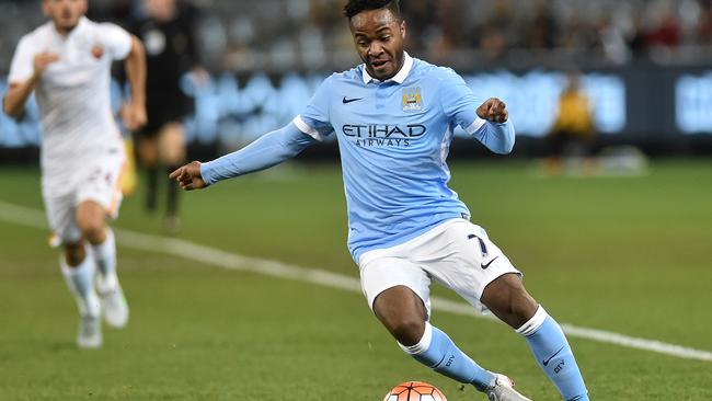 Manchester City player Raheem Sterling dribbles the ball on debut against AS Roma during the International Champions Cup game at the MCG in Melbourne, Tuesday, July 21, 2014. (AAP Image/Julian Smith) NO ARCHIVING, EDITORIAL USE ONLY