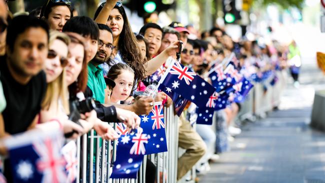 Crowds line the streets of Melbourne for an Australia Day parade. Picture: Nicole Cleary