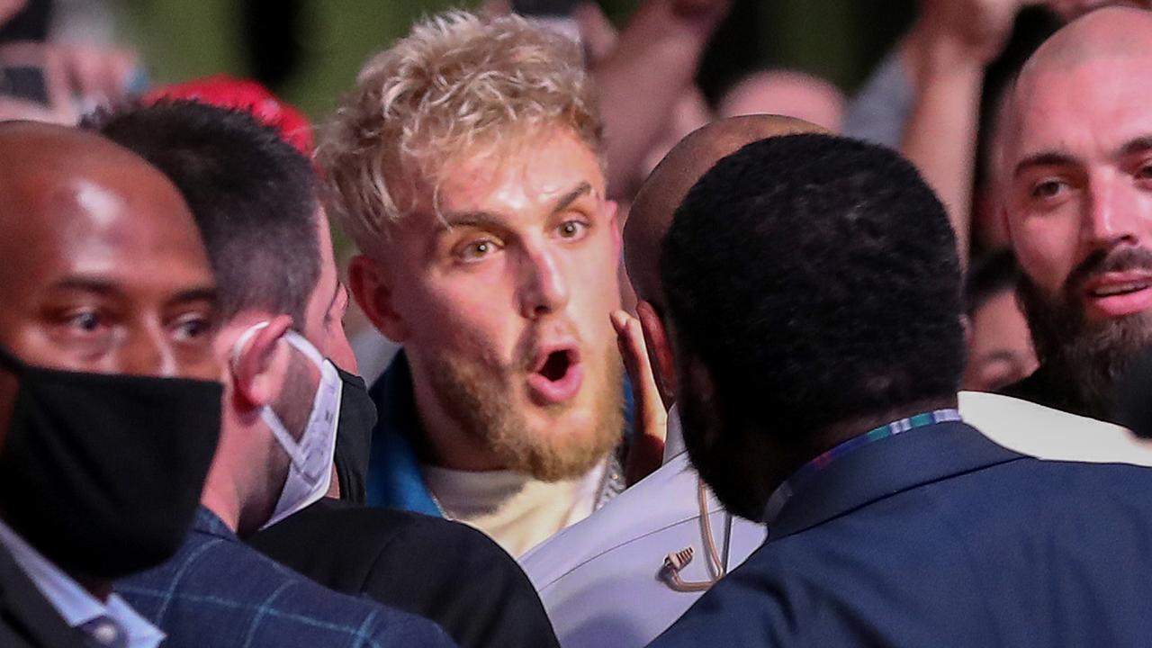 Jake Paul argues with Daniel Cormier at UFC 261.