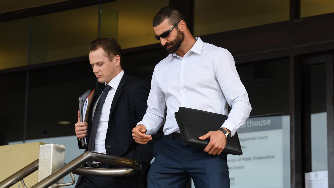 John Peros (right) leaves Mackay Court House on day three of the Shandee Blackburn inquest. He has been named the person responsible for her death.