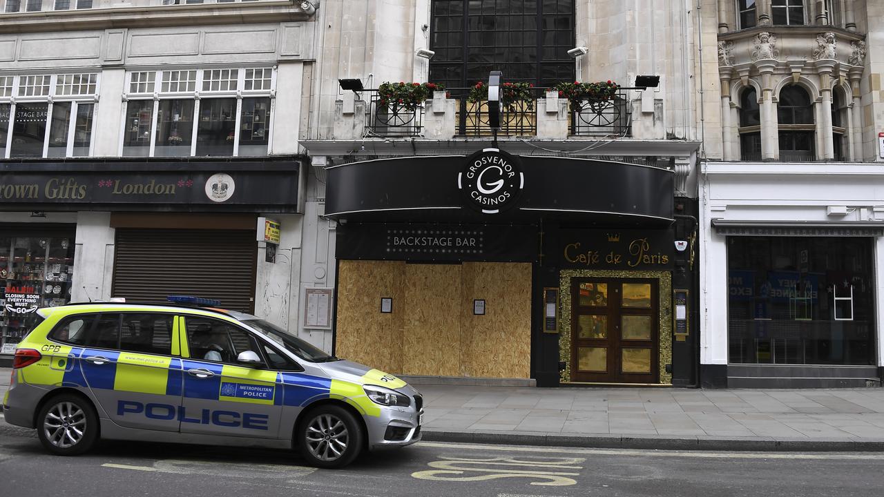 London police wait outside a casino ensuring it stays closed during the lockdown.