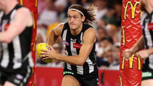 Darcy Moore runs the footy out of the Collingwood defence. Picture: Michael Klein