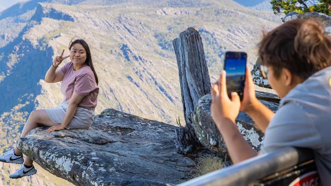 A tourist posing for a photo where Rosy Loomba slipped and fell. Picture: Jason Edwards