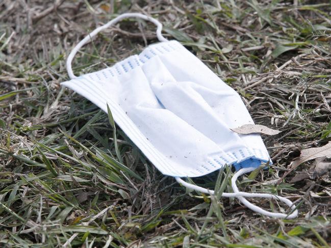 Mask on the ground discarded at Parklands Christian College, people heading in and out for testing of Covid-19, Park Ridge, on Friday 31st July 2020 - Photo Steve Pohlner