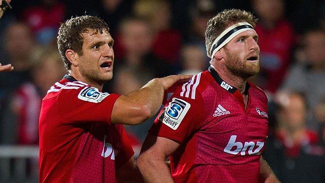 Captain of the Crusaders Kieran Read (R) is patted on the back by team mate Luke Whitelock as they watch the clock count down to to end the game during the Super 15 Rugby Union match between the Crusaders vs RSA Stormers at AMI Stadium in Christchurch on March 8, 2014. AFP PHOTO / MARTY MELVILLE