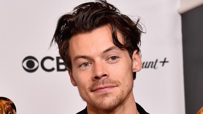 LOS ANGELES, CALIFORNIA - FEBRUARY 05: Harry Styles poses with the Best Pop Vocal Album Award for Ã¢â¬ÅHarryÃ¢â¬â¢s HouseÃ¢â¬Â and Album of the Year Award for Ã¢â¬ÅHarryÃ¢â¬â¢s HouseÃ¢â¬Â in the press room during the 65th GRAMMY Awards at Crypto.com Arena on February 05, 2023 in Los Angeles, California. (Photo by Alberto E. Rodriguez/Getty Images for The Recording Academy)