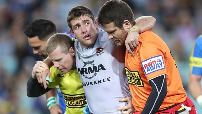 Andrew McCullough of the Broncos is carried from the field. Picture: Getty Images