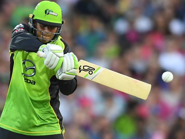 Thunder’s Usman Khawaja hammers the ball against Sydney Sixers at the SCG on Saturday. Picture: AAP