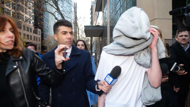 Isaiah Stephens is asked questions by media as he leaves court. Picture: Sarah Matray