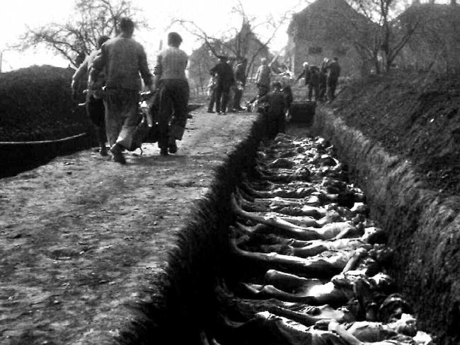 Rows of bodies await burial in pits at Nordhausen, after the liberation of the Nazi death camp by the United States. The IBM machines recorded for the Nazis how their prisoners died.