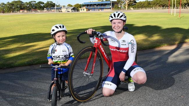 Miles Hennessy, 3, and SASI rider Heather May from the South Coast Cycling Club at Edwardstown Oval, which is getting an upgraded track and new clubrooms. Picture: AAP/Keryn Stevens