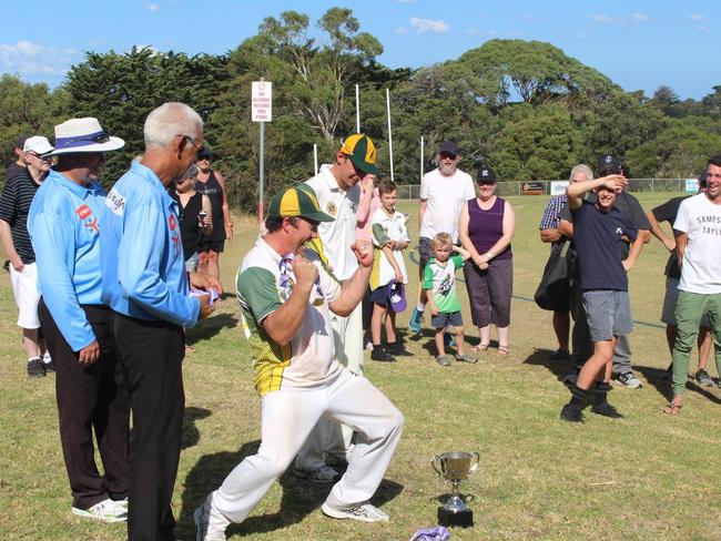 Dromana player Jeff Bluhm receives his premiership medal. Picture: Adam Voigt