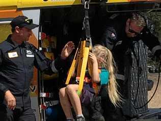 Amelia  Ward from Gogango State School gets winched into the RACQ rescue helicopter. Picture: contributed