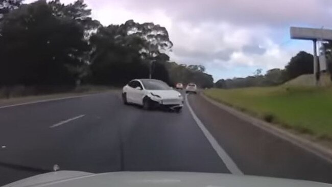 Dashcam footage captures the moment an out of control Tesla nearly hit multiple cars on the South Eastern Freeway. Picture: 7NEWS