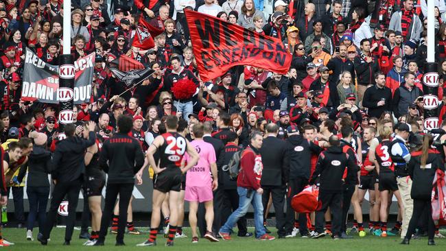 Essendon players thank their fans. Picture: George Salpigtidis