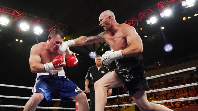 Barry Hall lands a right-hand on NRL rival Paul Gallen during their controversial draw. Picture: AAP/Michael Dodge