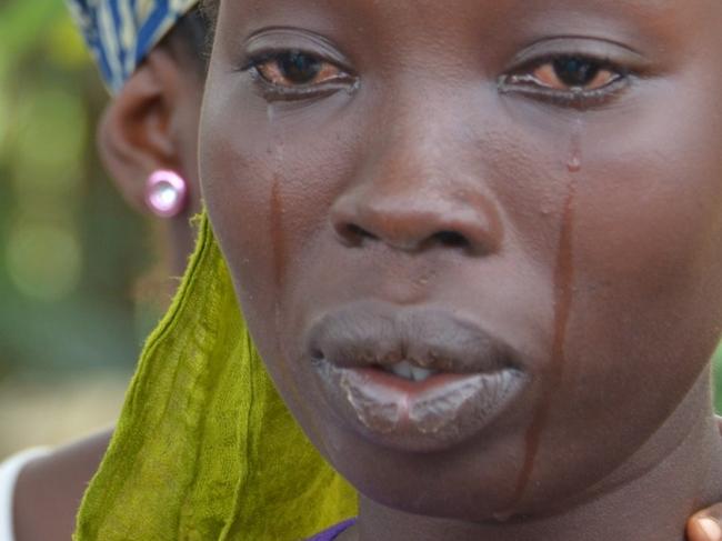 A woman cries the death of her husband victim of the Ebola virus on September 12, 2014 in Monrovia. Liberia has been hit hard by the Ebola epidemic, the worst in history, which has killed more than 2,400 people since it erupted earlier this year, according to World Health Organization. AFP PHOTO / ZOOM DOSSO