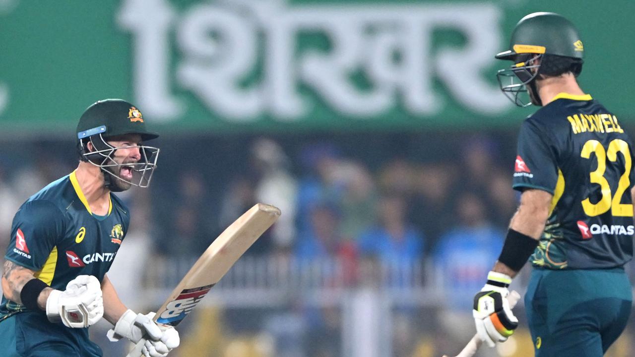 Matthew Wade (L) celebrates with Glenn Maxwell (Photo by Biju BORO / AFP)