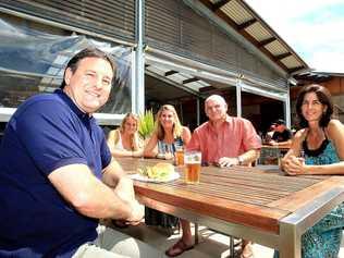 Consolidated Properties managing director Don O'Rorke joining Casuarina residents Jaime and Kerri Summerville, Peter Madden and Sharon Buchanan for a barbecue. Picture: Blainey Woodham