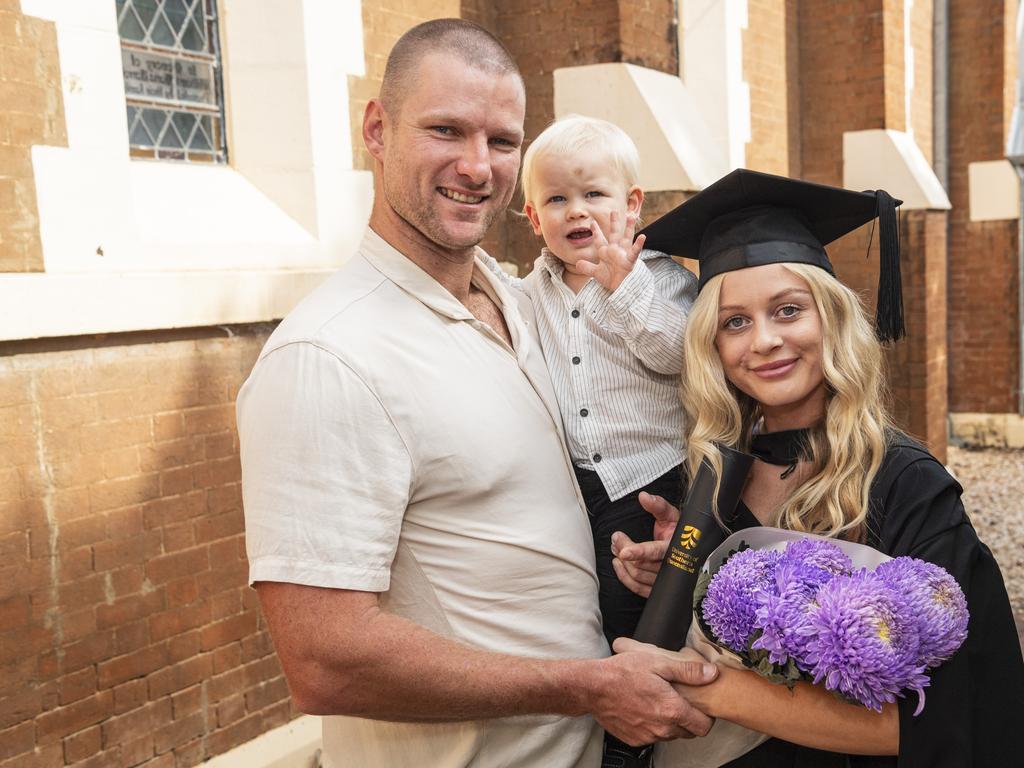 Bachelor of Paramedicine graduate Rachel Mackney with Louis Cartmill holding Oliver Cartmill at a UniSQ graduation ceremony at The Empire, Tuesday, June 25, 2024. Picture: Kevin Farmer