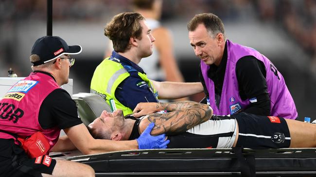 Jeremy Howe grimaces in pain as he is taken from the ground on a stretcher. Picture: Quinn Rooney/Getty Images