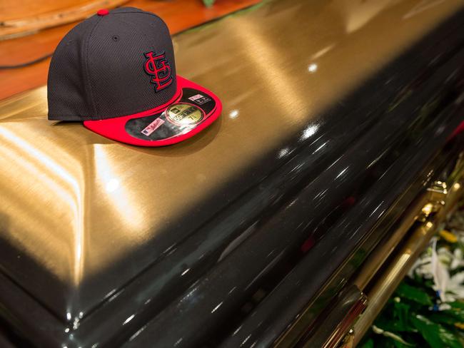 A St. Louis Cardinals baseball cap rests on top of Michael Brown's casket. Picture: Richard Perry