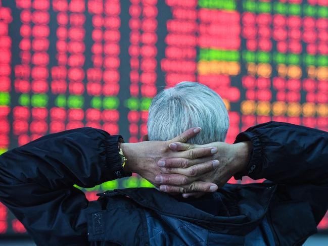 An investor looks at a screen showing stock market movements at a securities company in Hangzhou, in eastern China's Zhejiang province on February 8, 2024. (Photo by AFP) / China Out