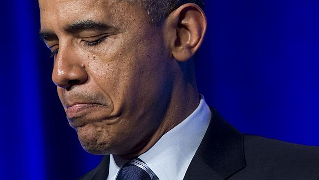 A grim-faced US President Barack Obama speaks about the healthcare reform laws  in Washington, DC / Picture: AFP