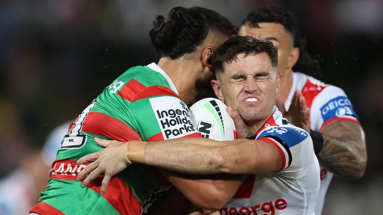 SYDNEY, AUSTRALIA – MAY 11: Keaon Koloamatangi of the Rabbitohs is tackled by Kyle Flanagan. (Photo by Mark Metcalfe/Getty Images)