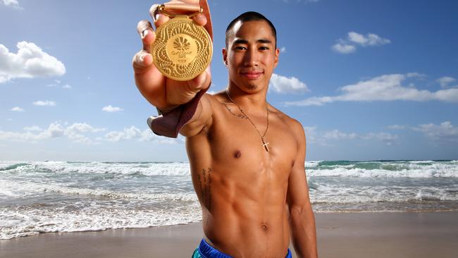 Chris Remkes after winning a gold medal at April’s Commonwealth Games. He overcame incredible odds as an orphan from the Philippines. Picture: Adam Head