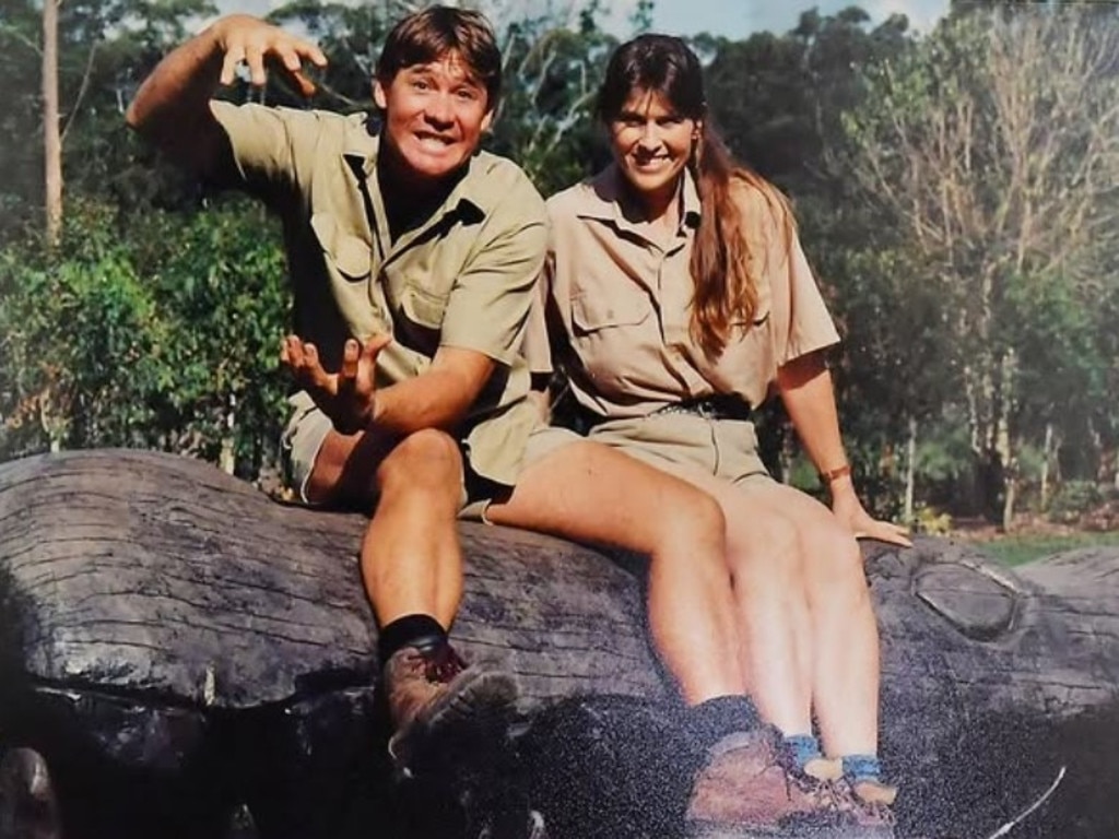 Steve and Terri Irwin sitting on a carved crocodile at Australia Zoo. Picture: Instagram