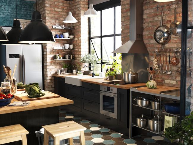 Exposed brick, oversized windows and industrial lamps are taking hold in home design. Ikea Faktum kitchen.