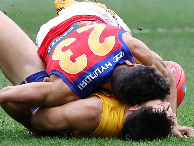 PERTH, AUSTRALIA - JULY 14: Liam Duggan of the Eagles lies concussed tackled by Charlie Cameron of the Lions during the 2024 AFL Round 18 match between the West Coast Eagles and the Brisbane Lions at Optus Stadium on July 14, 2024 in Perth, Australia. (Photo by Will Russell/AFL Photos via Getty Images)