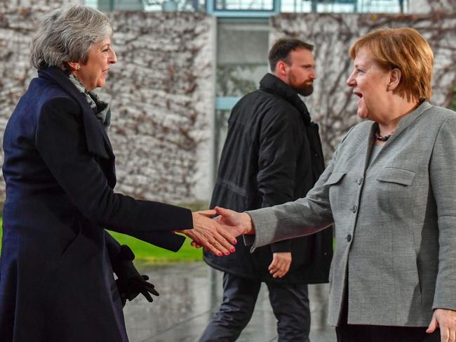 German Chancellor Angela Merkel (R) greets British Prime Minister Theresa May at the Chancellery in Berlin, on December 11, 2018, prior bilateral talks. - Embattled British Prime Minister Theresa May launched a tour of European capitals on December 11, 2018 in a desperate bid to salvage her Brexit deal, a day after delaying a parliamentary vote on the text to avoid a crushing defeat. (Photo by John MACDOUGALL / AFP)