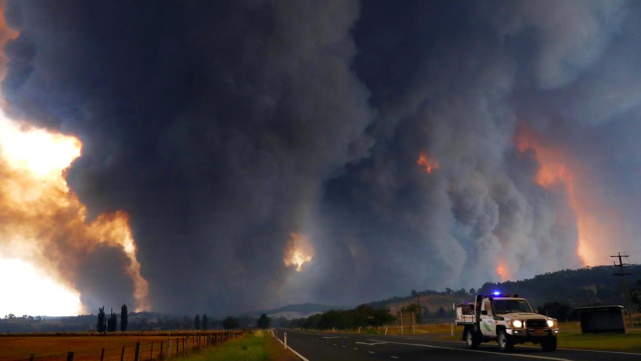 Massive smoke clouds fill the air. Picture: David Crosling