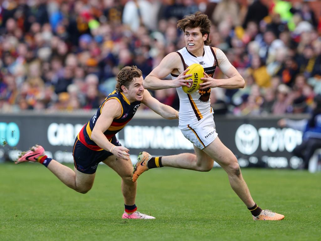 ADELAIDE, AUSTRALIA – JULY 28: Will Day of the Hawks and Zac Taylor of the Crows during the 2024 AFL Round 20 match between the Adelaide Crows and the Hawthorn Hawks at Adelaide Oval on July 28, 2024 in Adelaide, Australia. (Photo by Sarah Reed/AFL Photos via Getty Images)