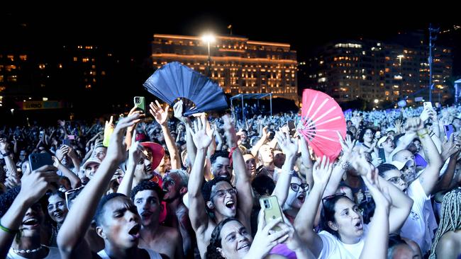 People sing and dance while Brazilian singer Ivete Sangalo performs ahead of the New Year celebration at Copacabana Beach in Rio de Janeiro. Picture: AFP