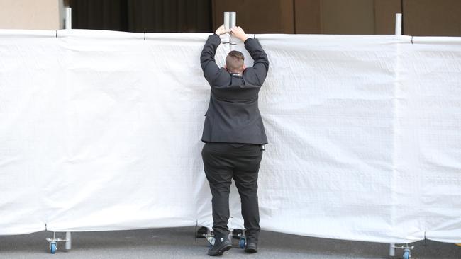 Security at the Sofitel in Brisbane wait for the Australian and Indian cricket teams to arrive. Picture: Lachie Millard