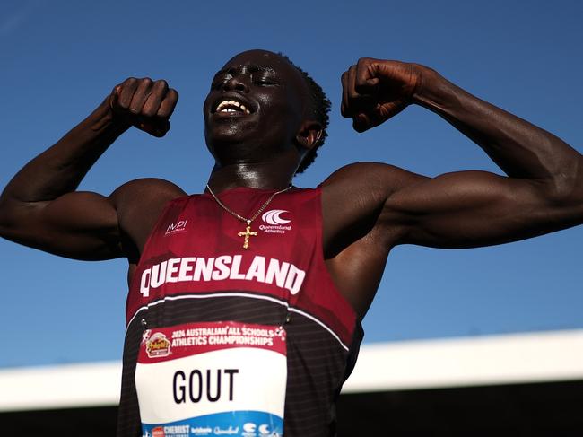 BRISBANE, AUSTRALIA - DECEMBER 07: Gout Gout of Queensland celebrates winning the Boys' U18 200m Final in a new national time of 20.04 seconds during the 2024 Chemist Warehouse Australian All Schools Athletics Championship at Queensland Sport and Athletics Centre on December 07, 2024 in Brisbane, Australia. (Photo by Cameron Spencer/Getty Images)