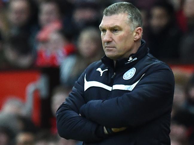 Leicester City's English manager Nigel Pearson watches from the touchline during the English Premier League football match between Manchester United and Leicester City at Old Trafford in Manchester, northwest England, on January 31, 2015. AFP PHOTO / PAUL ELLIS RESTRICTED TO EDITORIAL USE. No use with unauthorized audio, video, data, fixture lists, club/league logos or “live” services. Online in-match use limited to 45 images, no video emulation. No use in betting, games or single club/league/player publications