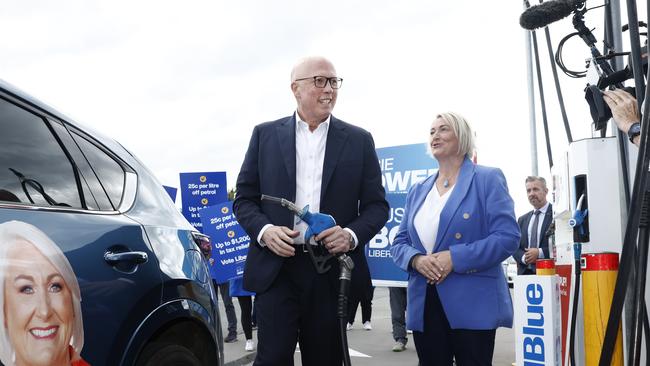 Opposition Leader Peter Dutton and Liberal candidate for Lyons Susie Bower stop for fuel to talk about the Coalition’s petrol price policy. Picture: Richard Dobson / NewsWire